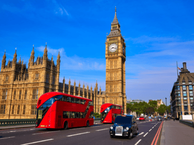London: a red bus drives past Big Ben
